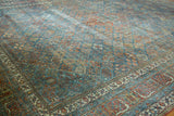 Fine Joshegan carpet detail, distressed sapphire blue, ruby red, and emerald garden motifs.