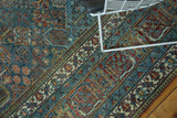 Distressed vintage Joshegan carpet, sapphire blue, ruby red, emerald floral and vine motifs.