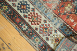 Detail of antique Caucasian Kazak rug: geometric panels, barber pole border, and reverse.