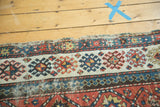 Polychromatic selvage and geometric panel design of an antique Caucasian Kazak runner.