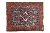 Antique Karaja rug with triple medallion Heriz pattern in red, navy, and green with wear, 5'2