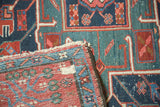 Antique Karaja rug's hand-knotted reverse and pile, showing geometric navy, red, green patterns.