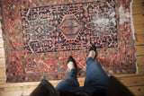Vintage Karaja rug with triple medallion design, bold colors, and visible pile wear.