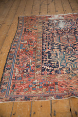 Vintage Karaja rug side view, showing madder red border with rectilinear floral motifs.