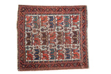 Antique Afshar square rug with an allover repeating bird motif in red, blue, and brown on an ivory ground.