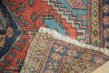 Hand-knotted fringe and visible tightly woven foundation of an antique Heriz runner.