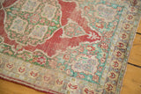 Worn antique Turkish Kaisary silk rug detail: pale cherry, mint green, Oushak-style floral motifs.