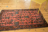 Vintage Lilihan rug's paneled tree of life motif in blush, rich sky blue, and dark chocolate.