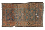 Antique distressed Belouch rug with sapphire blue geometric guls and terra cotta borders. Circa 1910.
