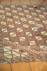Antique Persian Belouch rug, geometric lattice pattern in saffron, brown, ivory with perimeter wear.