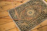 Banded perimeter of antique Jalili Tabriz rug securing raw edge, with charcoal and rust patterns.