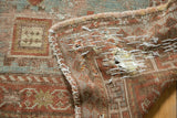 Hand-stitched reinforcement on the time-worn foundation of an Antique Distressed Caucasian rug.
