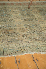 Distressed pile texture with faded geometric Bokhara guls on a vintage Turkmen rug.
