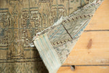 Geometric pile pattern, woven back, and tattered fringe of the vintage Turkmen rug.