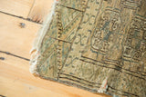 Faded Bokhara guls, tattered fringe, and distressed pile on a vintage Turkmen rug.