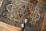 A lifestyle view showing the scale of a hand-knotted Haji Jalili Tabriz rug.