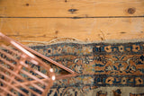 Detail showing the hard tatter and secured side of the antique Persian Tabriz rug.