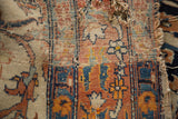 Hard tatter and scattered holes revealing the foundation of an antique Persian Haji Jalili rug.