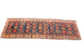 Antique 1850s Persian runner with deep blue field and large floral Veramin motifs.