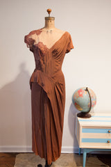 Brown 1940s Dorothy O'Hara evening gown featuring its unique draped, pointed hem.