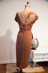 Vintage 1940s brown Dorothy O'Hara gown back, showing pointed hem and soft patina.