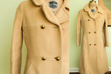 Vintage 1960s Saks Fifth Avenue buttery yellow wool coat with gold buttons.