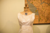 Vintage 60s wedding dress bodice with intricate floral lace and boat neckline.
