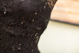 Intricate black lace detail with shimmering sequins from the vintage 50s evening gown.
