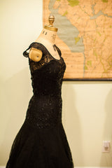 Black lace and sequin bodice with elegant drop-waist detail of vintage gown.