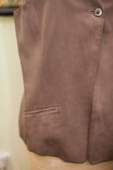 Brown suede texture of the vintage Burberry's vest, showing a side welt pocket.