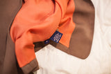 Vintage Burberry's vest orange 100% silk lining, showing 'Made in USA' label.
