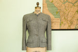Structured gray wool 1940s ladies jacket with chest and hip flap pockets.