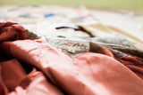 Lillie Rubin jacket brand tag, reddish-brown lining, and muted brown leather.