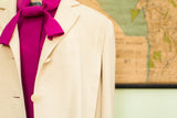 Vintage 60s Neiman Marcus ivory cashmere coat with vibrant magenta tie.