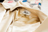 Neiman Marcus label and luxurious golden beige silk lining of the ivory cashmere coat.