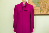Vibrant fuchsia vintage Pauline Trigere dress with a pussy-bow neckline.