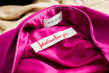 Pauline Trigere Saks Fifth Avenue labels on vibrant fuchsia silk lining of dress.