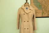 Vintage Saks Fifth Avenue buttery yellow wool coat with double-breasted gold buttons.