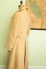 Back detail of 1960s Saks Fifth Avenue yellow wool coat, featuring pleating and gold buttons.