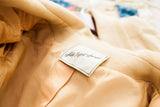 Saks Fifth Avenue label inside a 1960s buttery yellow wool coat.