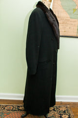 Black Dunhill Tailors mens wool coat, side view with plush dark fur collar.