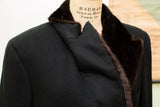 Textured black wool shoulder and rich brown fur collar of a vintage coat.