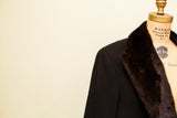 Dark brown fur collar and black wool shoulder of a vintage Dunhill coat.