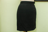 Vintage 80s Jean Paul Gaultier black pinstripe suit skirt, front view.