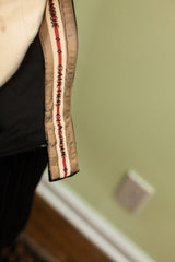 Beige Gaultier Classique trim with red stripe on black pinstripe 80s suit skirt.