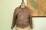 Bubble-like silhouette of the vintage Lillie Rubin light brown leather jacket.