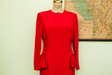 Red 80s Carolina Herrera dress with gathered detailing at hips.