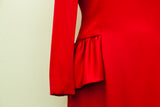 Vibrant red satin trim and gathered waist detail on the Carolina Herrera dress.