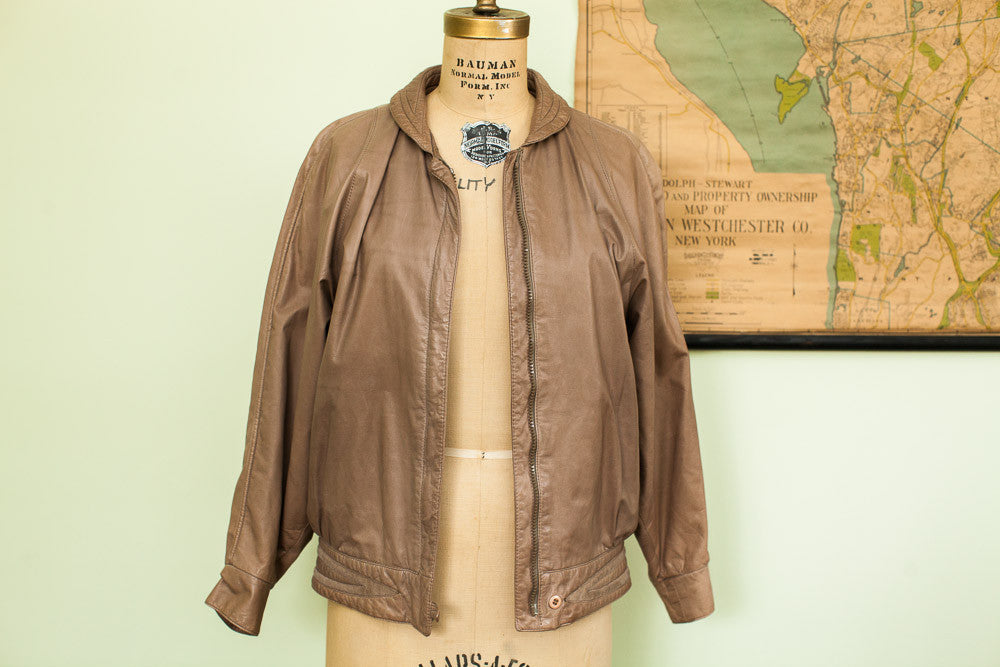 Vintage Lillie Rubin 80s brown leather bubble jacket with a soft, supple texture.