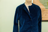 Blue velvet Beenebag jacket with subtle polka dot pattern and front buttons.